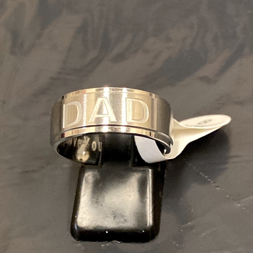 Silver toned men’s ring engraved “Dad”